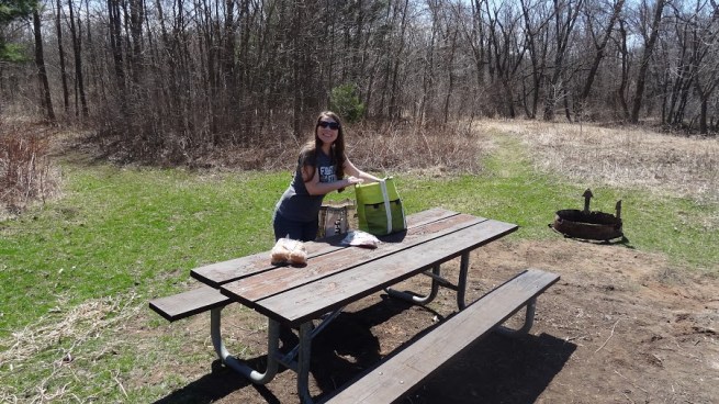 Breeah preps the picnic table. This was a great spot for lunch as it was right on the river bank. No signs in the area, but you can find it by taking the trail on the right (once you park at the Sandrock Cliffs lot)