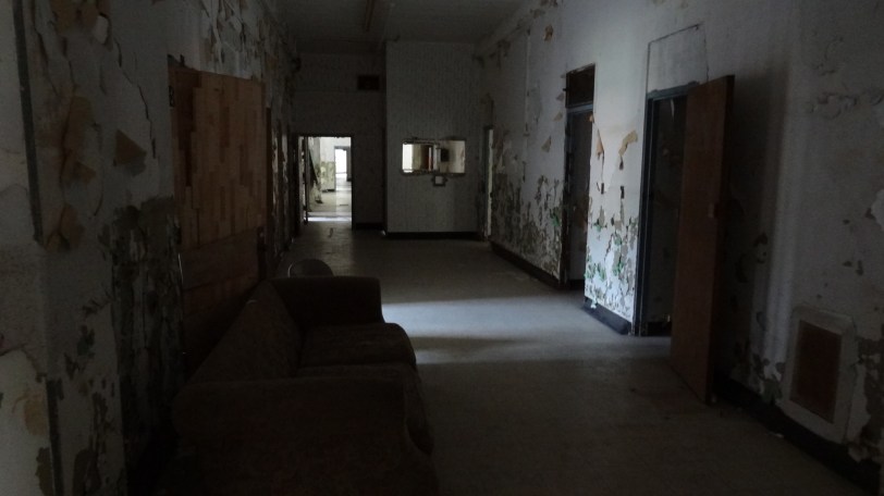 The first floor of the asylum, with a view towards the nursing station (window opening towards the back right)